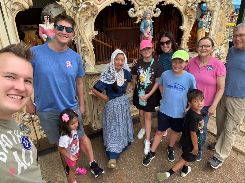 The extended family at Dutch Village in front of an antique pipe organ